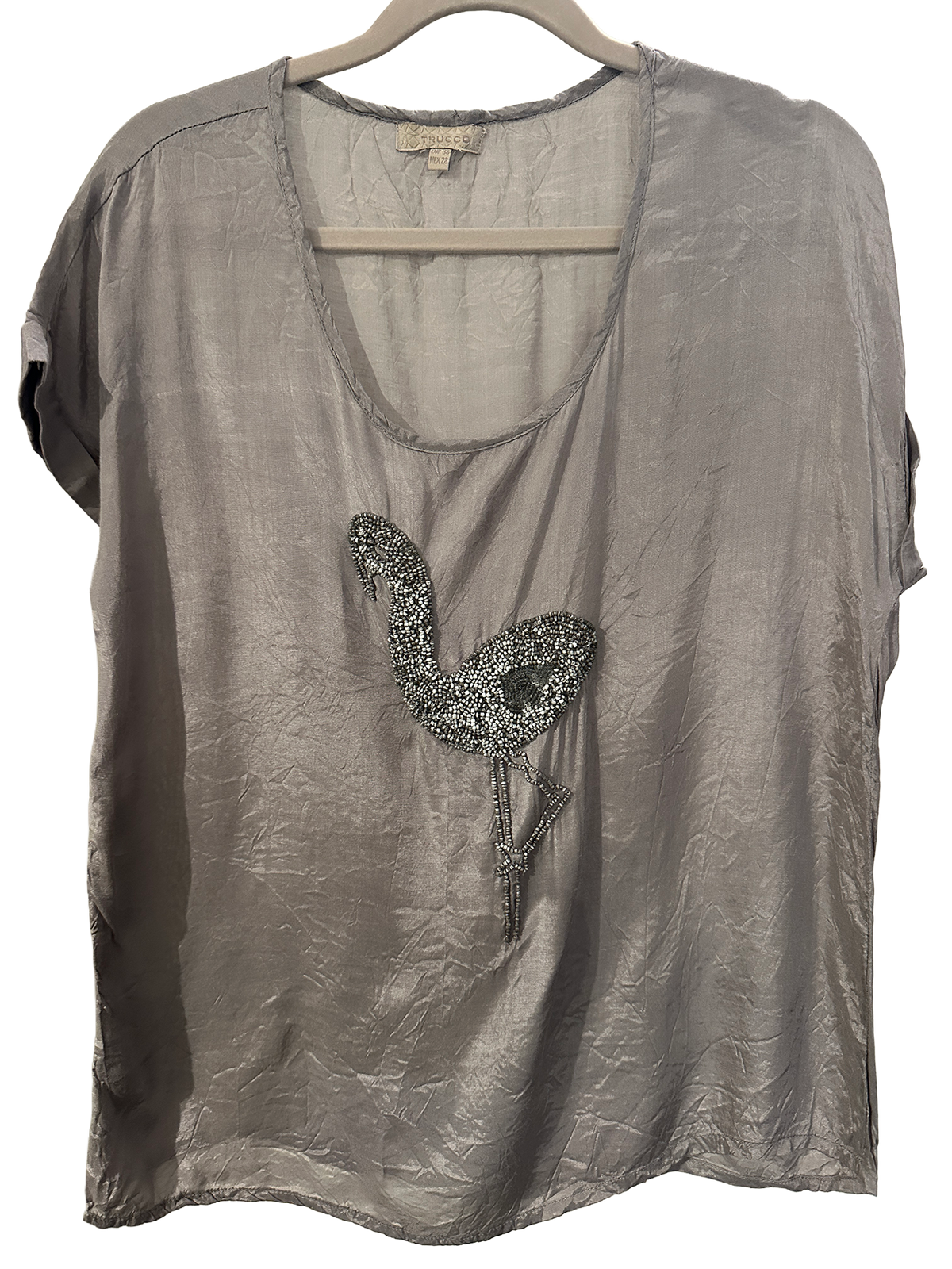 Bluse med perlebroderi av en fågel