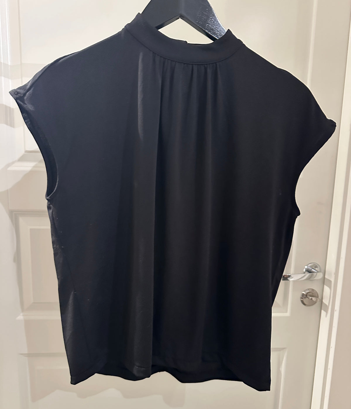 Sort topp i trikot